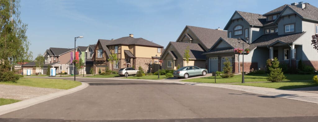 suburban street with winding road and houses