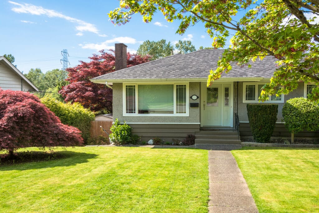 a bungalow with light green lawn